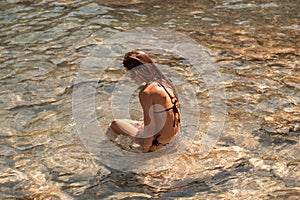 Cutie young girl having fun in sea