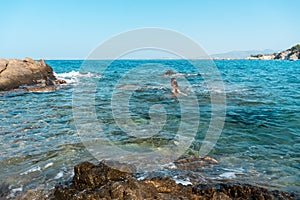 Cutie young girl having fun in sea