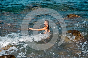 Cutie young girl having fun in sea