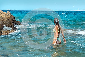 Cutie young girl having fun in sea