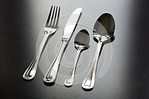 Cutlery on a black background. Fork, spoon, knife