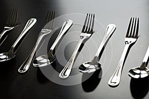 Cutlery on a black background. Fork, spoon, knife