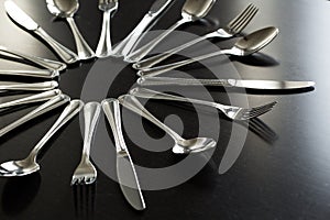 Cutlery on a black background. Fork, spoon, knife.