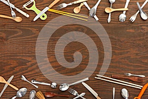 Cutlery frame on wooden background