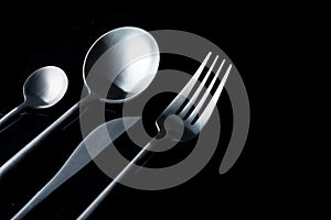 Black fork, knife and spoon