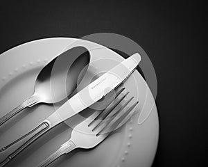 Cutlery set fork knife and spoon isolated on white plate Kitchen Utensils