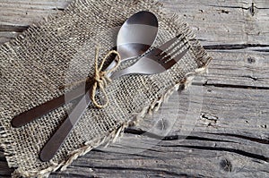 Cutlery set:fork and spoon on rustic wooden table.Cutlery on old wooden background.Can be used as background menu for restaurant.