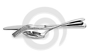 Cutlery. Spoon,fork and knife stacked up on a white