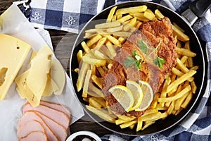 Cutlet Cordon Bleu with French fries, close-up