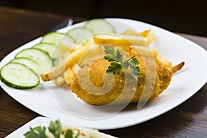 Cutlet de volaille with fries photo