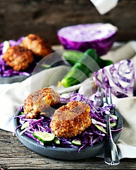 Cutlets with red cabbage and cucumber salad