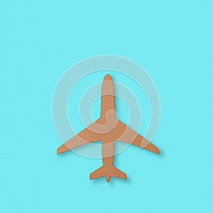 Cutout of an airplane over a blue background