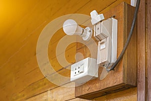 Cutouts and power plugs on old wooden walls