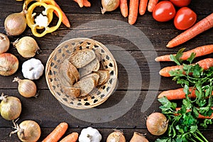 Cutted bread with fresh vegetables mix on the table