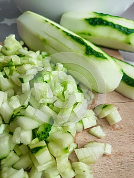 Cutted cucumbers on board for salad fresh recipy