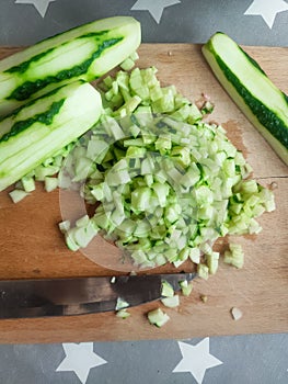 Cutted cucumbers on board for salad fresh recipy