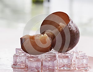 Cutted of Plumcot fruit with red pulp