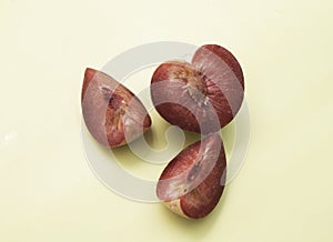 Cutted of Plumcot fruit with red pulp