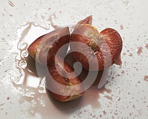 Cutted of Plumcot fruit with red pulp