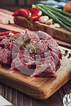 Cutted raw beef rump tail with ingredients - In close-up