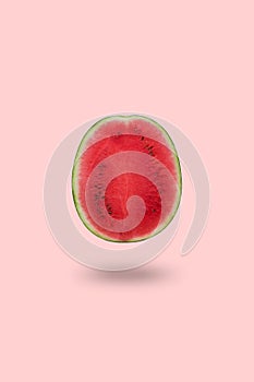 Cutted watermelon isolated on pink background with a shadow