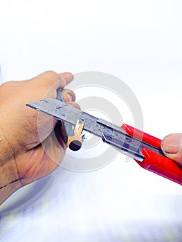 A cutter can be used to sharpen wooden pencils