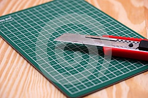 Cutter on green cutting mat