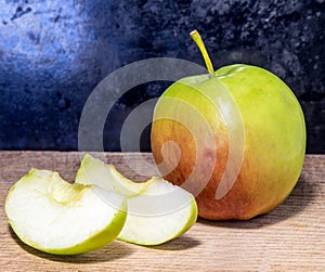 Cutting apple on a board