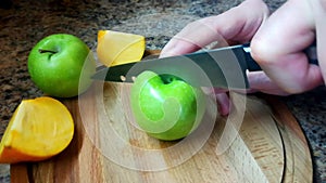 Cutting apples on a wooden cutting board