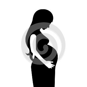 Cutting black silhouette of pregnant woman with large belly