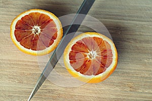 Cutting a blood orange in half