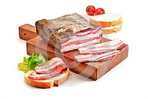 Cutting board with bacon and bread