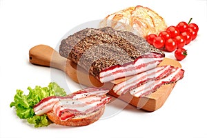 Cutting board with bacon and bread
