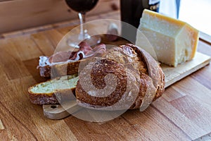 Cutting board cheese bread and red wine