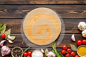 Cutting board in frame of food for chef work on wooden background top view space for text