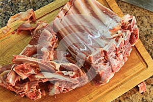 cutting board with fresh lamb ribs