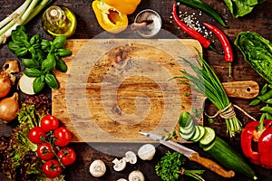 Cutting Board and Knife with Vegetables on Table