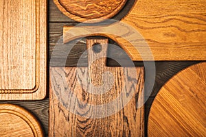 Cutting board over towel on wooden kitchen table.