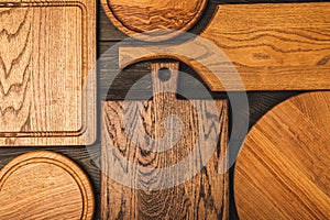 Cutting board over towel on wooden kitchen table.