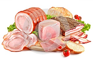 Cutting board with pork, bacon, ham and bread