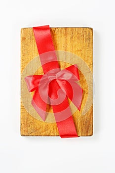 Cutting board with red ribbon and bow