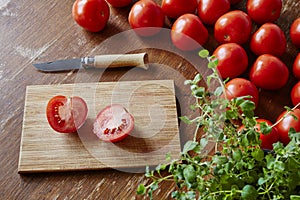 Cutting board scene with tomatoes