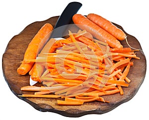 Cutting board with sliced carrot and ceramic knife