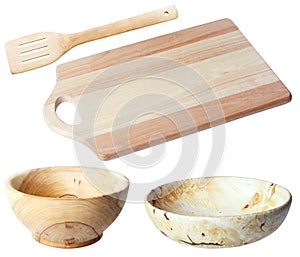 Cutting board two wooden bowls wooden shovel, isolate.