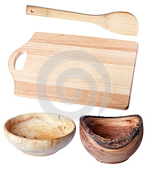 Cutting board two wooden bowls wooden shovel, isolate.