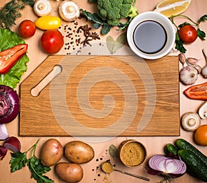 Cutting board, vegetables, herbs and spices. Colorful ingredient