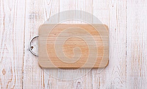 Cutting board on wooden background