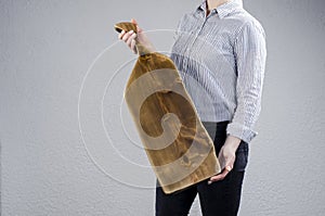 Cutting board. Young woman hold a large kitchen board in her hands.
