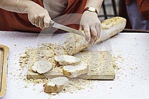 Cutting bread in a shop