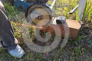 Cutting bricks with an angle grinder, construction work, the process of execution close-up